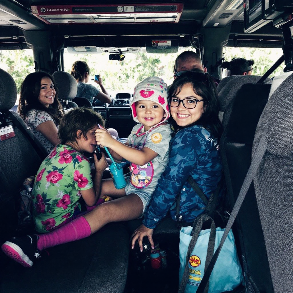 Family in car with baby seat in Bali